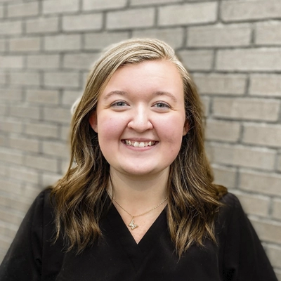 A headshot of Jasmine Austin, the Clinic Director at Premier Family Chiropractic.