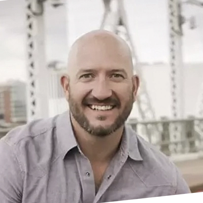 A headshot of Dr. Quinn Uzelman, a chiropractor at Premier Family Chiropractic.