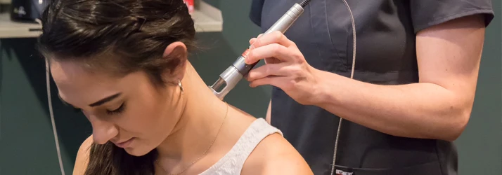 Laser Specialist Works on Patient's Neck